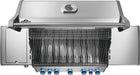 Top view of an open stainless steel grill with blue-lit control knobs, sleek cooking grates, a warming rack, and closed side burners.