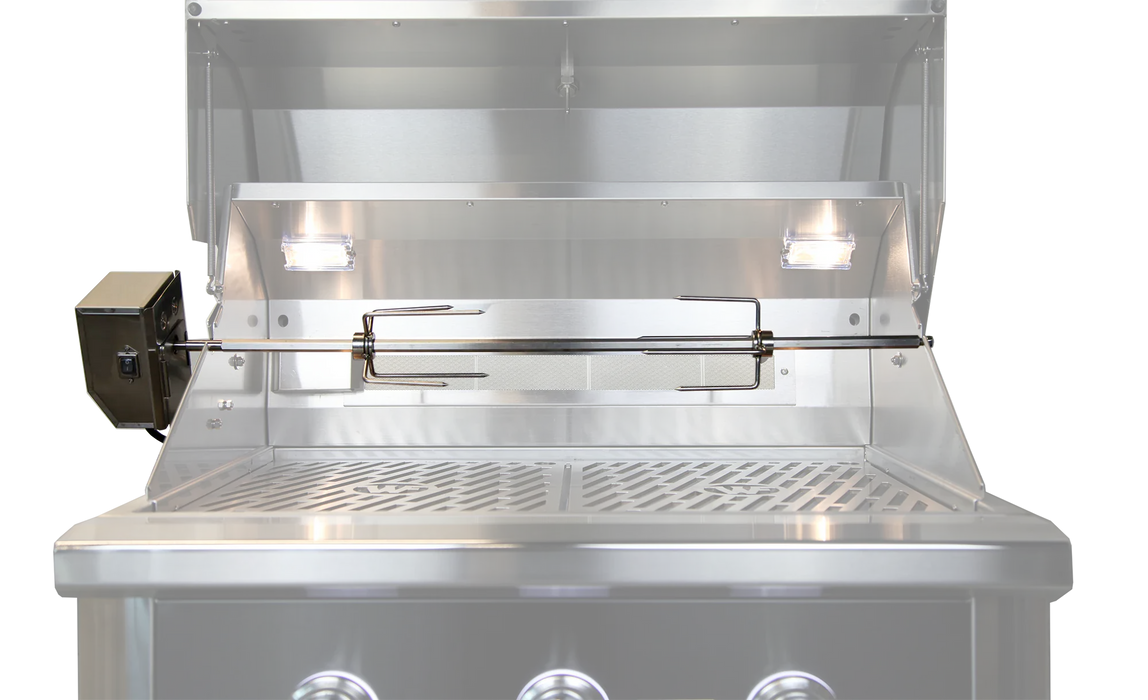 Stainless steel grill interior with mounted rotisserie spit, motor housing on the left, cooking grates, and dual interior lights.