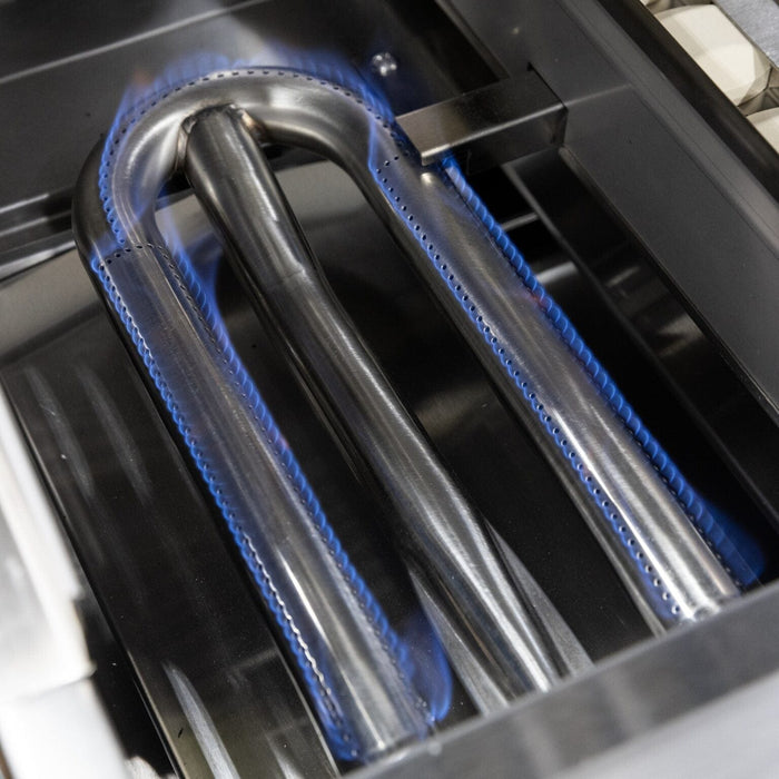 Close-up of stainless steel U-shaped grill burner with blue flames evenly distributed along the edges.