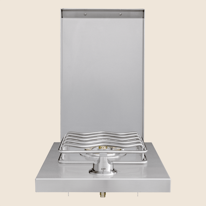 Stainless steel outdoor single side burner with raised grate and protective back panel.