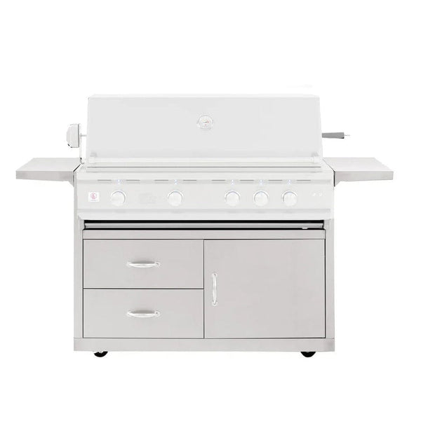 Stainless steel outdoor gas grill with closed lid, control knobs, side shelves, and storage drawers on wheeled cart base.