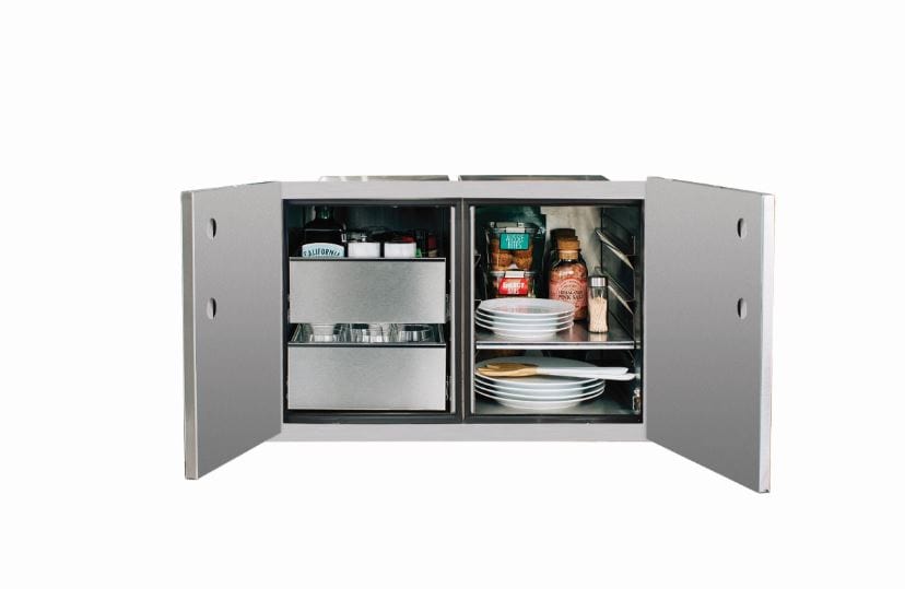 Open stainless steel cabinet with double doors, showcasing organized shelves holding plates, jars, and storage drawers for outdoor use.