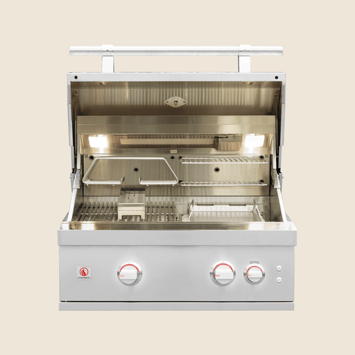 Open stainless steel gas grill showing illuminated cooking area, warming rack, and three control knobs with red lights.
