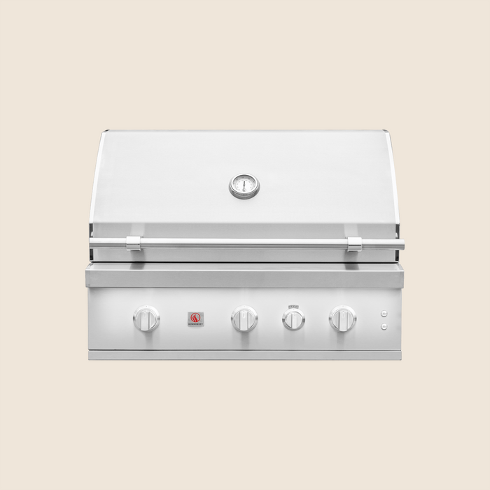 Stainless steel outdoor gas grill with four control knobs and built-in temperature gauge on the hood.