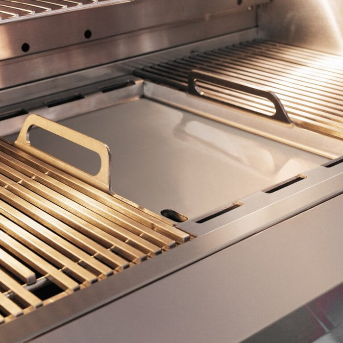 Close-up of stainless steel grill interior showing removable cooking grates and heat zone separators.