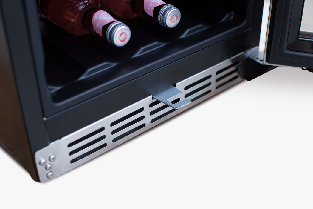 Close-up of a ventilation grille at the bottom of a beverage cooler, showcasing airflow design and part of the interior storage.