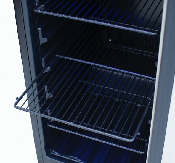 Interior of a refrigerator with multiple adjustable wire shelves and blue LED lighting illuminating the empty storage space.