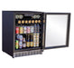 Glass-door beverage fridge with open door, displaying assorted cans and bottles arranged on adjustable shelves, under bright lighting.