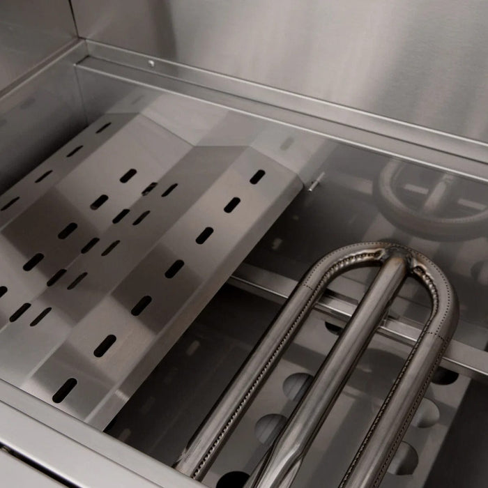 Close-up of a stainless steel grill interior featuring perforated heat plates and dual U-shaped burners.