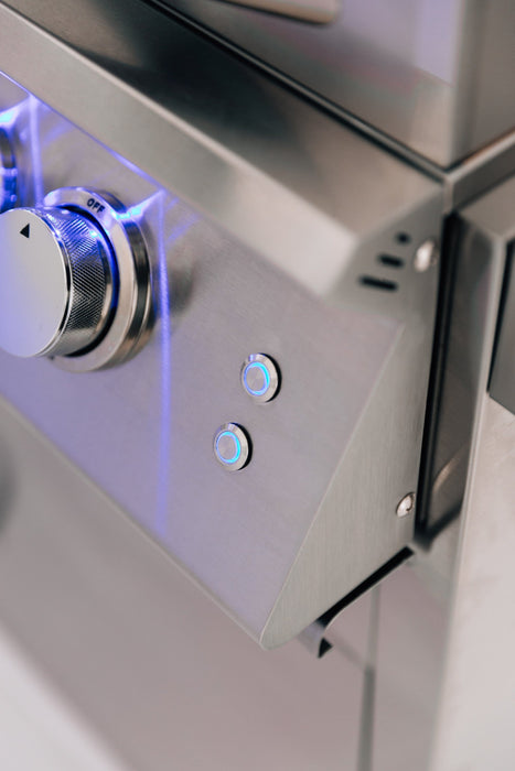 Close-up of a stainless steel grill control panel with a single knob and two illuminated blue control buttons.