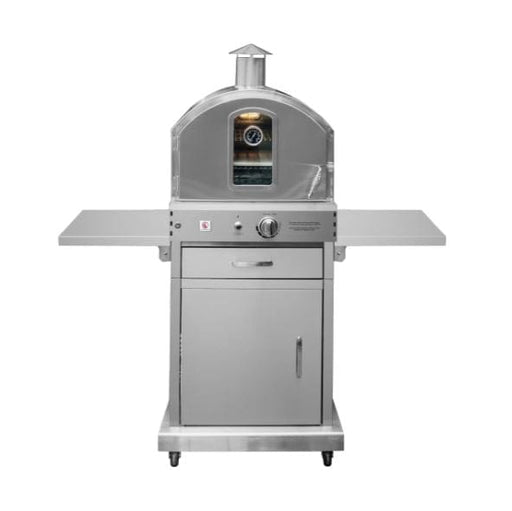 Stainless steel outdoor oven on a wheeled cart with side shelves, a glass door, and a built-in temperature gauge on the front.