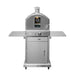 Stainless steel outdoor oven on a wheeled cart with side shelves, a glass door, and a built-in temperature gauge on the front.