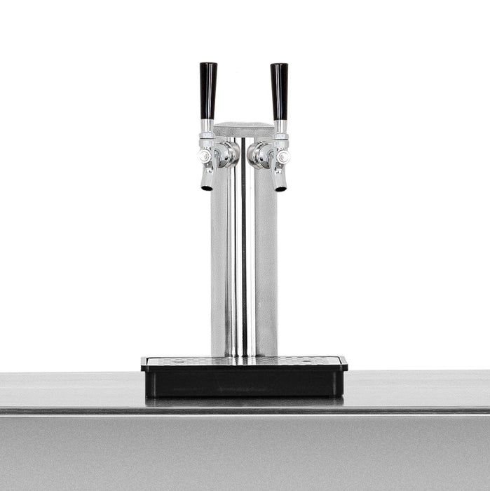 Close-up of a stainless steel dual-tap beverage dispenser with black handles and a drip tray, mounted on a sleek metallic surface.