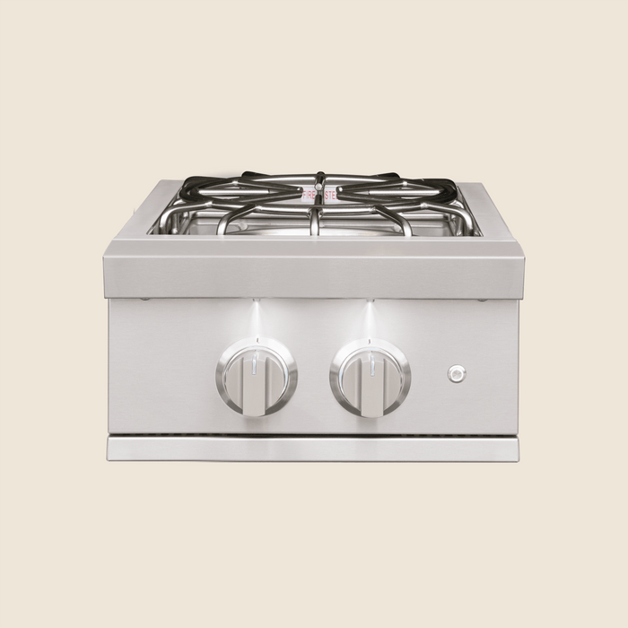 Stainless steel double side burner with two control knobs and cast metal grates for precise outdoor cooking.