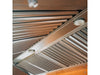 A detailed view of a stainless steel vent hood's underside, featuring slatted filters and built-in lights for efficient ventilation and visibility.