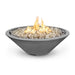 Cazo gas fire pit in dark gray color made of GFRC concrete with a narrow ledge, filled with lava rocks and featuring a sleek, modern design with flames.