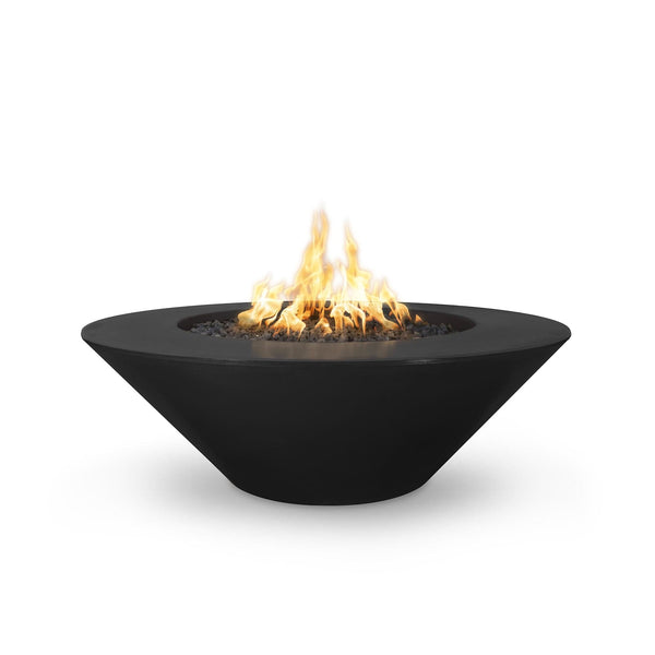 Modern outdoor fire pit with a sleek, black, bowl-shaped design, filled with black stones and producing a bright, warm flame.