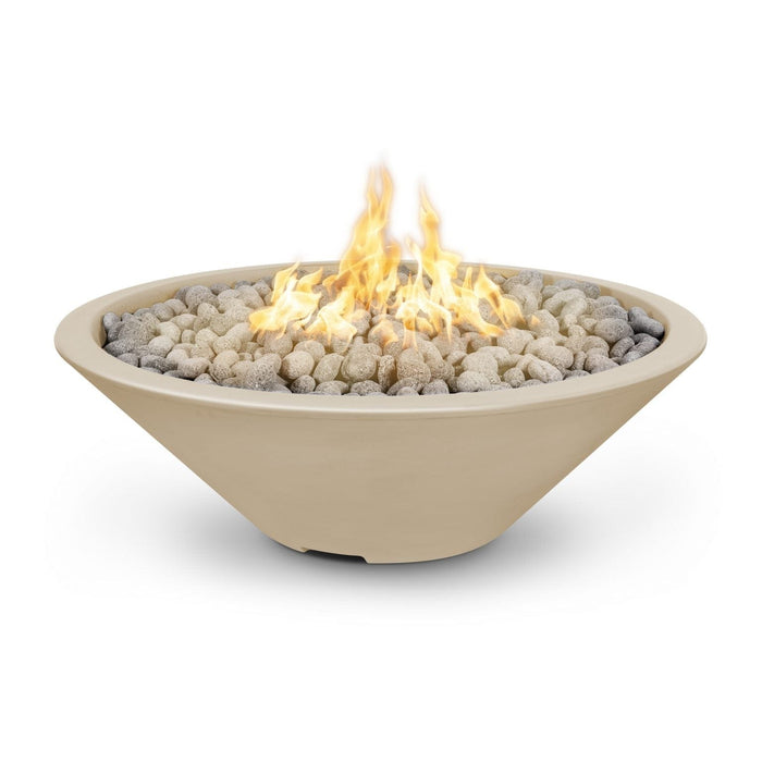 Cazo gas fire pit in vanilla color made of GFRC concrete with a narrow ledge, filled with lava rocks and featuring a sleek, modern design with flames.