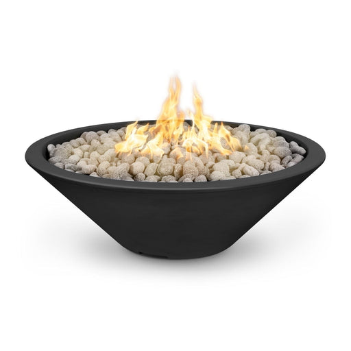 Cazo gas fire pit in black color made of GFRC concrete with a narrow ledge, filled with lava rocks and featuring a sleek, modern design with flames.