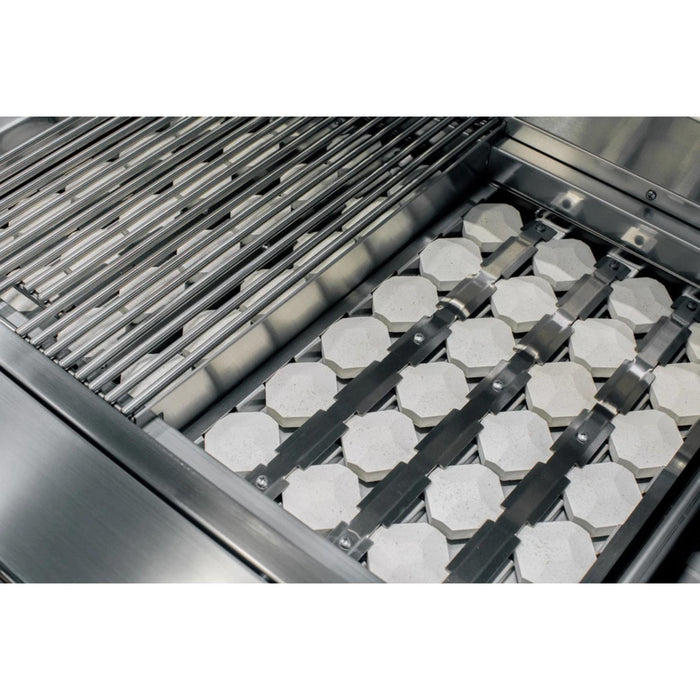 American Made Grills Alturi 42-inch built-in gas grill with stainless steel cooking grates lifted to show the ceramic briquette heat distribution system.
