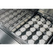 American Made Grills Alturi 42-inch built-in gas grill with stainless steel cooking grates lifted to show the ceramic briquette heat distribution system.