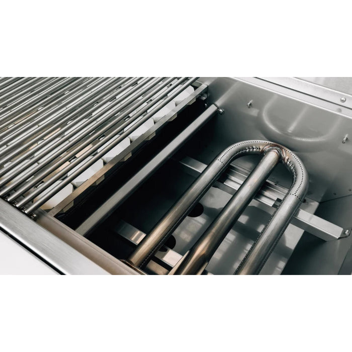 American Made Grills Alturi 42-inch built-in gas grill with cooking grate and ceramic briquettes removed to show the stainless steel U-shaped burner.