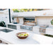 American Made Grills Alturi 42-inch built-in gas grill installed in a modern outdoor kitchen with stainless steel storage and side burner.
