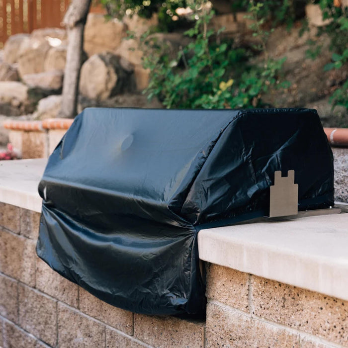 American Made Grills Alturi 42-inch built-in grill cover protecting a grill installed in an outdoor kitchen.
