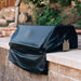 American Made Grills Alturi 42-inch built-in grill cover protecting a grill installed in an outdoor kitchen.