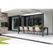 Bromic Platinum electric patio heaters recessed into the ceiling of a modern covered outdoor dining area with contemporary furniture