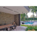Bromic Platinum Smart-Heat ceiling-mounted electric patio heaters above an outdoor dining area overlooking a swimming pool