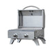 Stainless steel portable gas grill with dual control knobs, foldable legs, and an open lid showcasing a compact cooking area