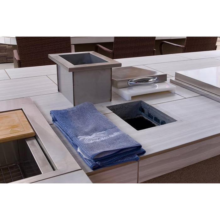 Kokomo Grills stainless steel trash chute and removable cutting board shown during BBQ island installation