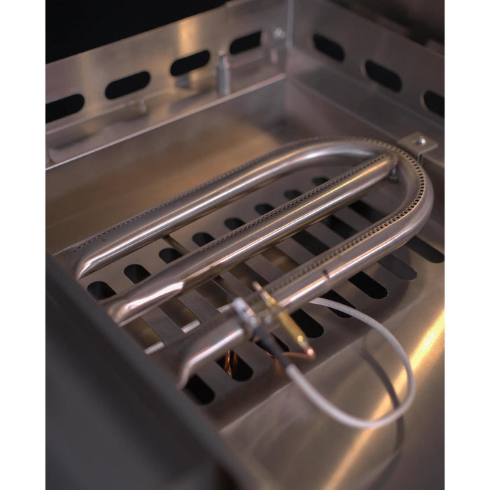 Close-up of Le Griddle Pro Series 105 U-shaped stainless steel gas burner with thermocouple safety sensor inside the griddle housing