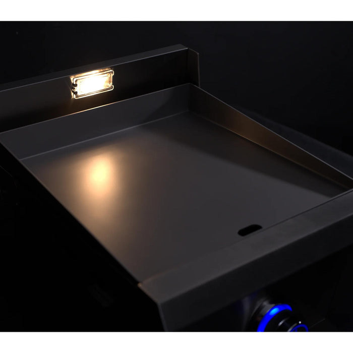Le Griddle Pro Series 40 gas griddle with concealed grease collection tray partially extended, blue LED control knob, and illuminated cooking surface.