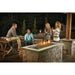 Napoleon GPFL48 48-inch linear gas fire pit burner installed in a custom outdoor patio fire feature for backyard entertaining