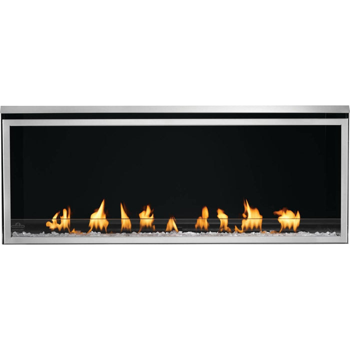 Napoleon Galaxy 50 linear outdoor gas fireplace with clear glass embers, glass wind guard, and black reflective interior panels