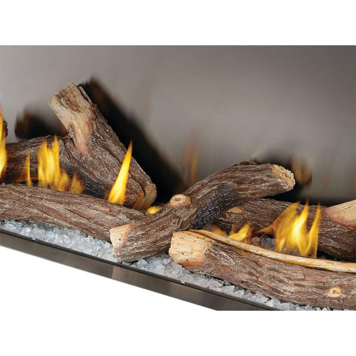 Napoleon Galaxy 62 outdoor gas fireplace close-up with split oak logs, clear glass embers, and yellow flames