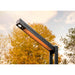 Close-up of Napoleon Phantom 1,500W infrared patio heater heating element and integrated LED spotlight in an outdoor setting