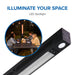 Napoleon Phantom electric outdoor patio heater with integrated LED spotlight illuminating a backyard dining area