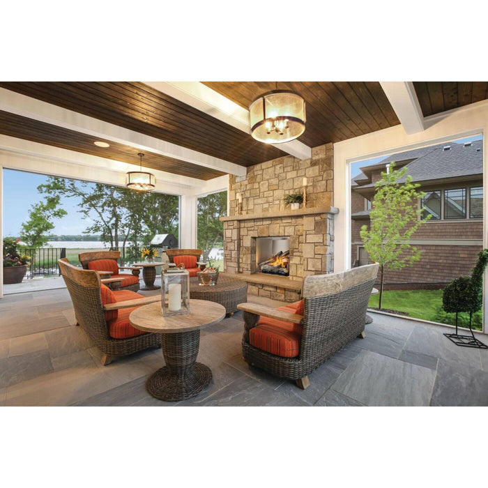 Napoleon Riverside 36-inch outdoor gas fireplace installed in a stone patio fireplace surround with comfortable outdoor lounge seating.