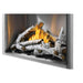 Angled view of Napoleon Riverside 42 built-in outdoor fireplace featuring realistic birch logs, burning flames, and a clean-face metal surround.