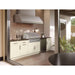 Covered outdoor kitchen with stainless steel Summerset vent hood installed above a built-in gas grill and outdoor refrigerator.