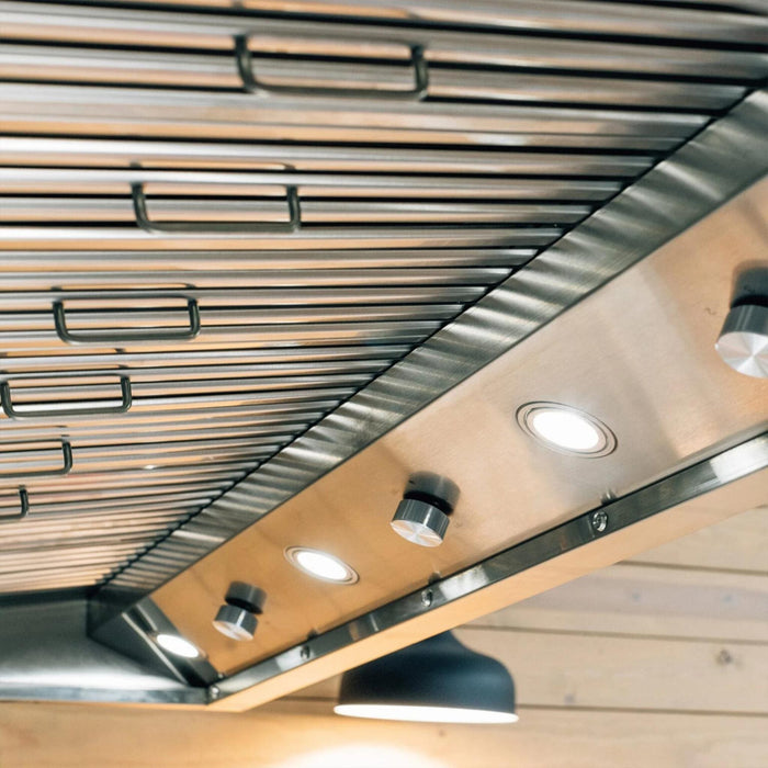 Underside of Summerset 42-Inch Outdoor Vent Hood showing stainless steel baffle filters, LED lights, and control knobs