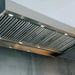 Close-up of Summerset Outdoor Vent Hood control knob and integrated LED lighting beside stainless steel baffle filters