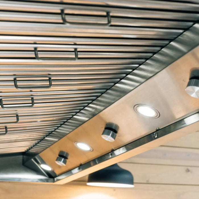 Summerset 60-inch outdoor vent hood underside showing stainless steel filters, control knobs, and LED lights
