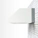 Summerset 4-inch spacer bracket installed between a 60-inch outdoor vent hood and wall
