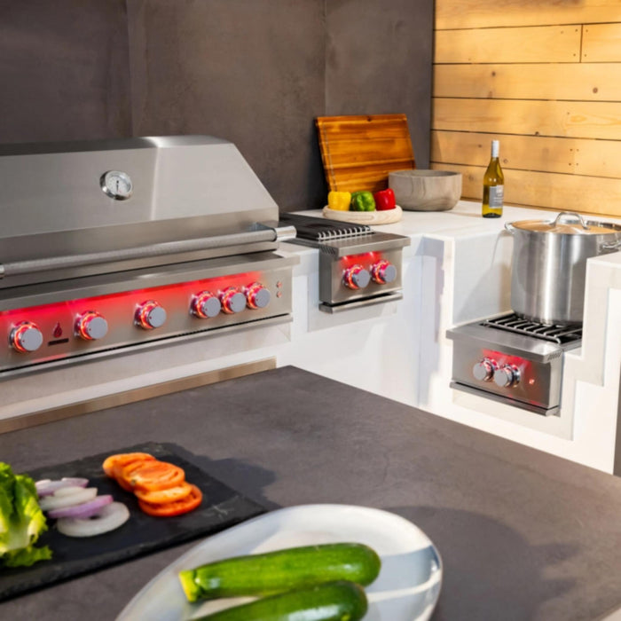 TrueFlame 32-inch built-in gas grill installed in a modern outdoor kitchen with matching stainless steel side burner and power burner.