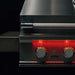 Close-up of TrueFlame 40-inch built-in gas grill showing the stainless steel hood, knurled handle, and red LED illuminated burner controls.