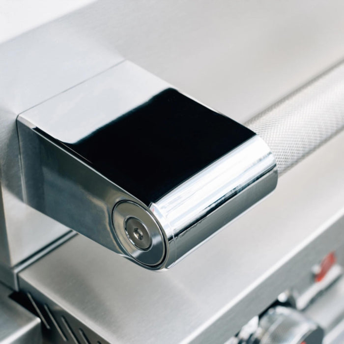 Close-up of the TrueFlame E-Series gas grill stainless steel hood handle and polished end cap.
